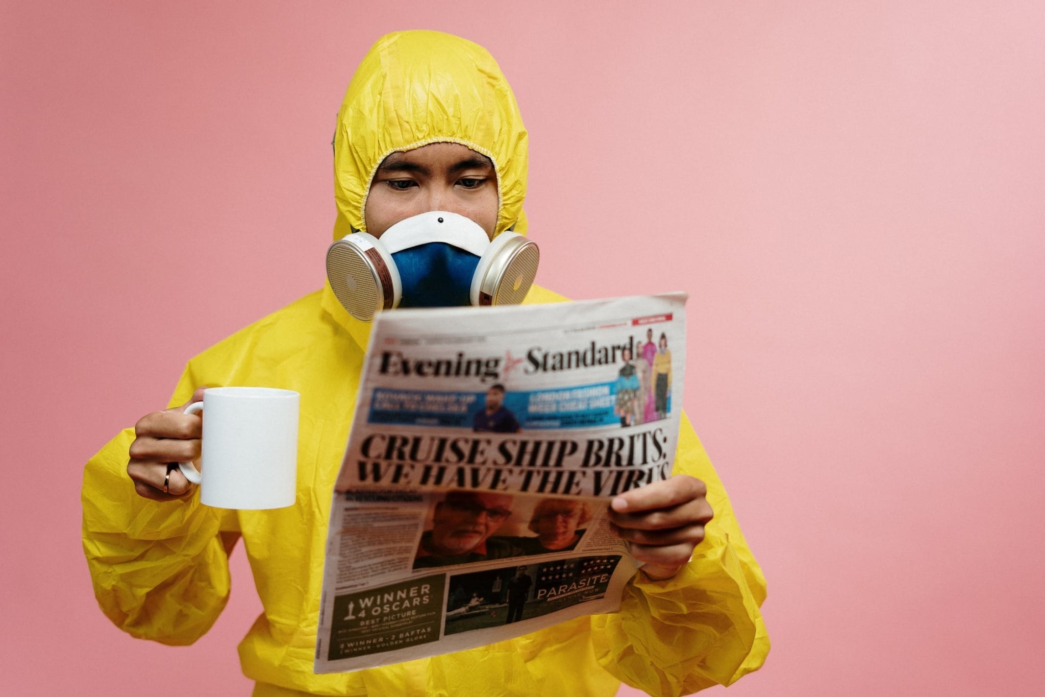 Man in suit reading a newspaper