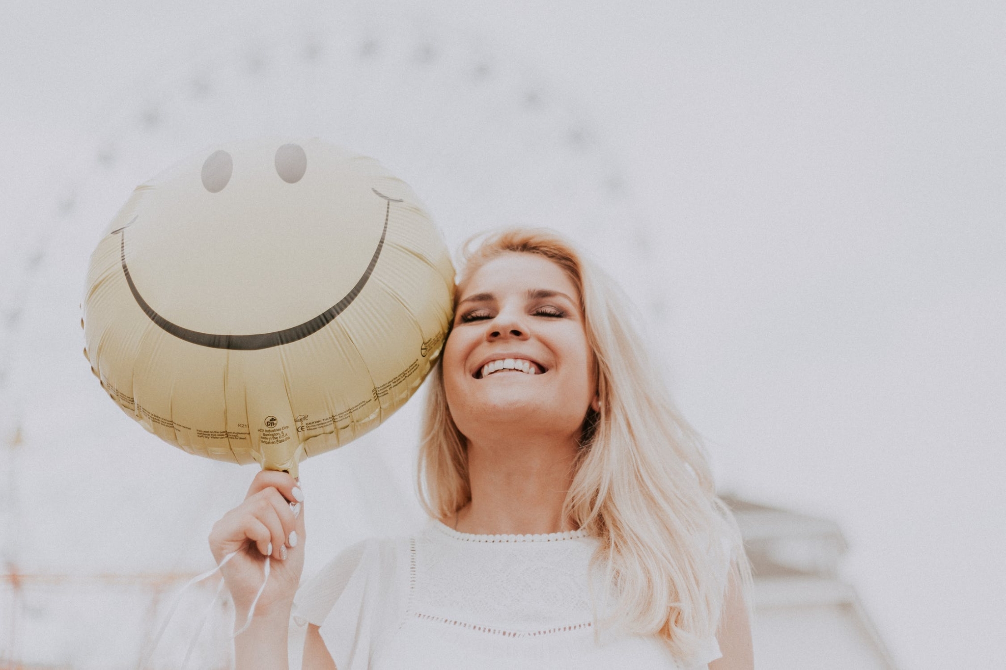 Smiling woman with balloon
