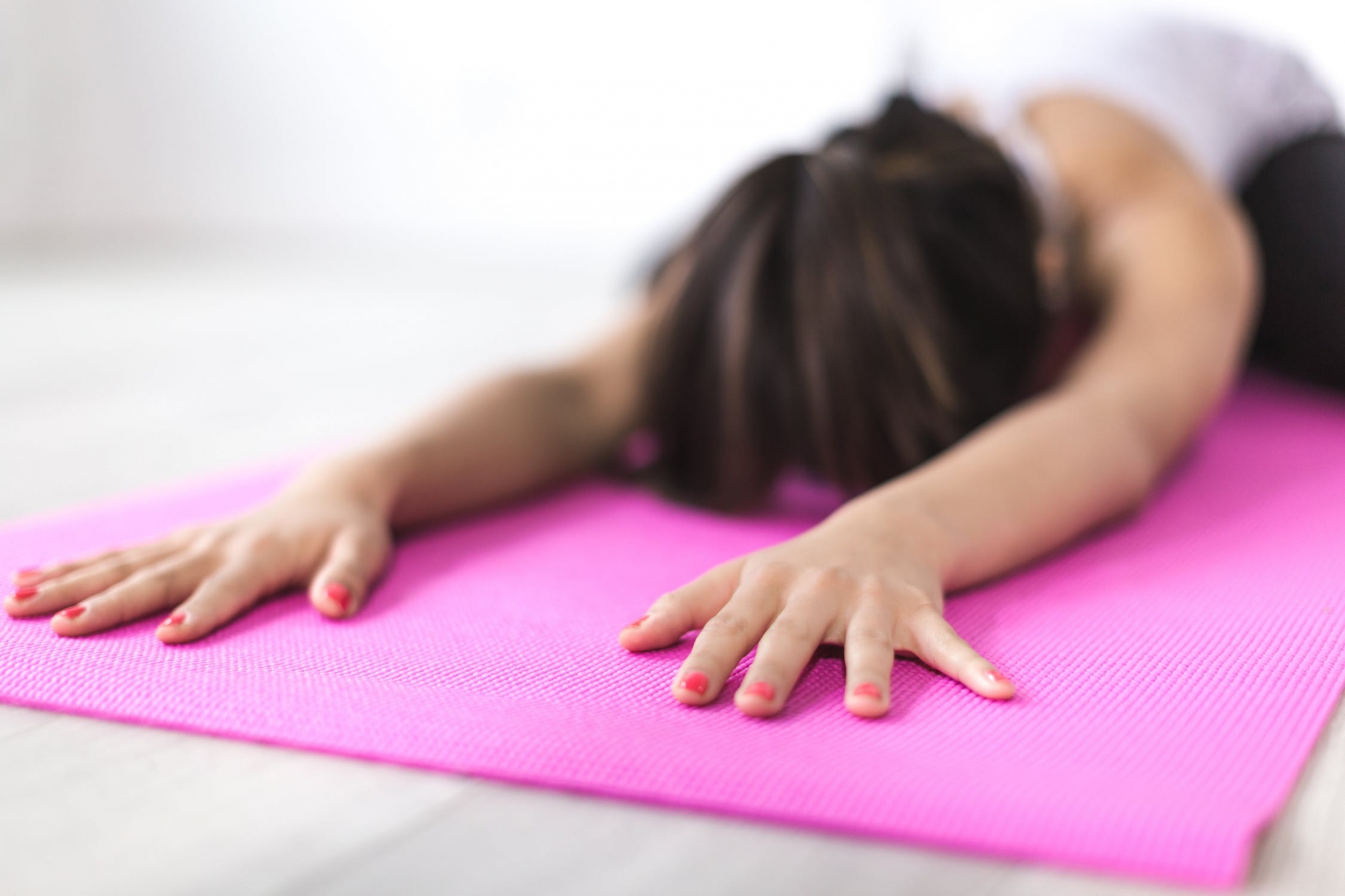 Woman stretching on a mat