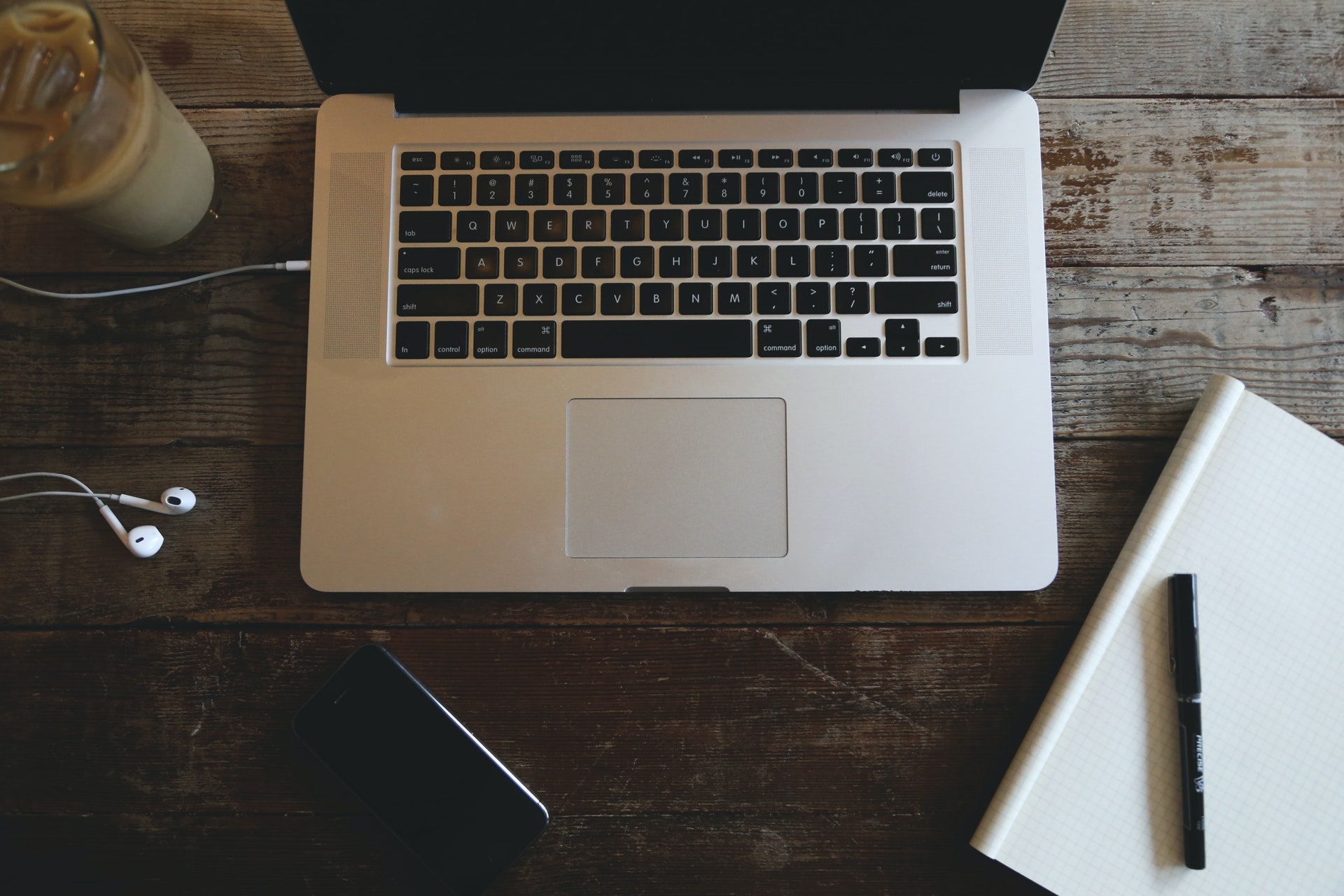 Close up of a lap top and study materials