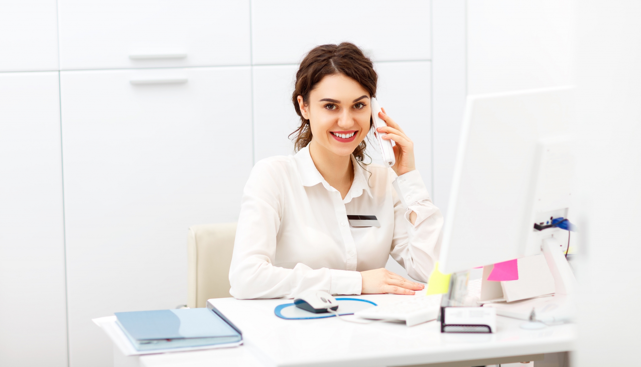 Female professional smiling on the phone