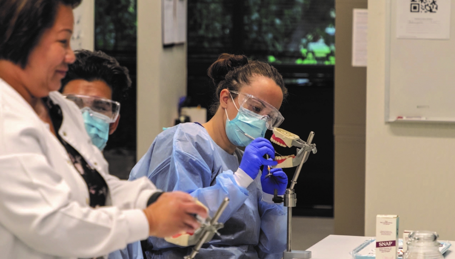 Dental Assisting students practicing in a skills lab