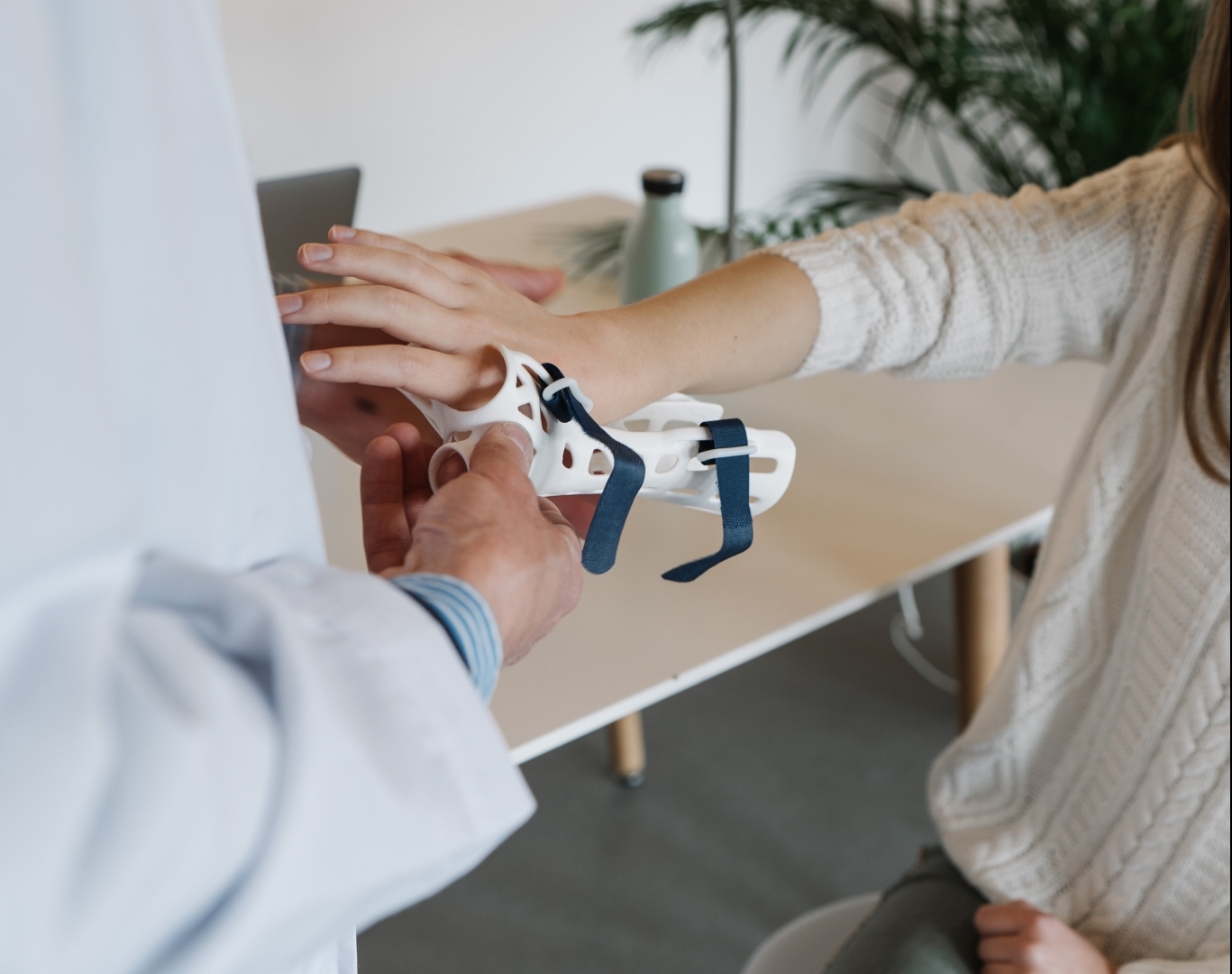 Healthcare professional placing a splint