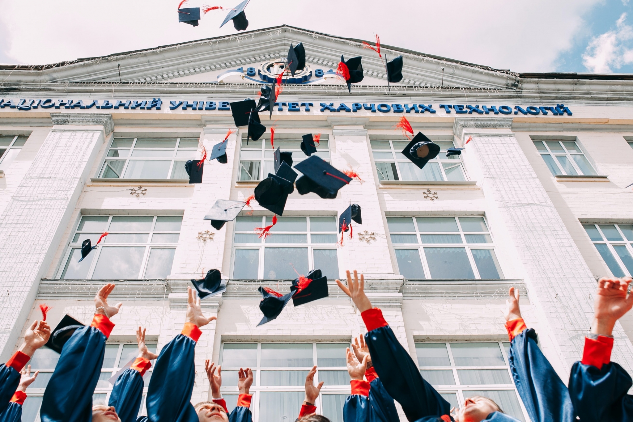 Graduates throwing their caps in the air
