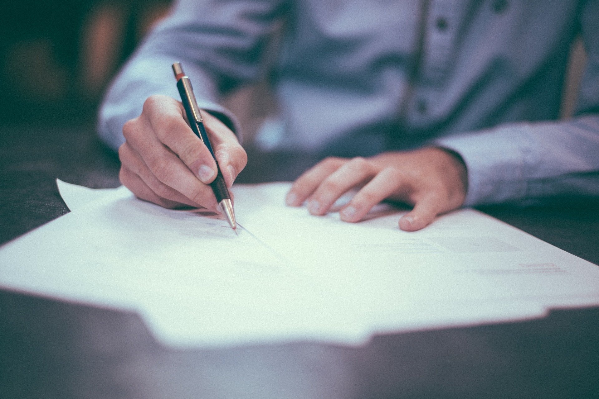 Close up of a man taking notes