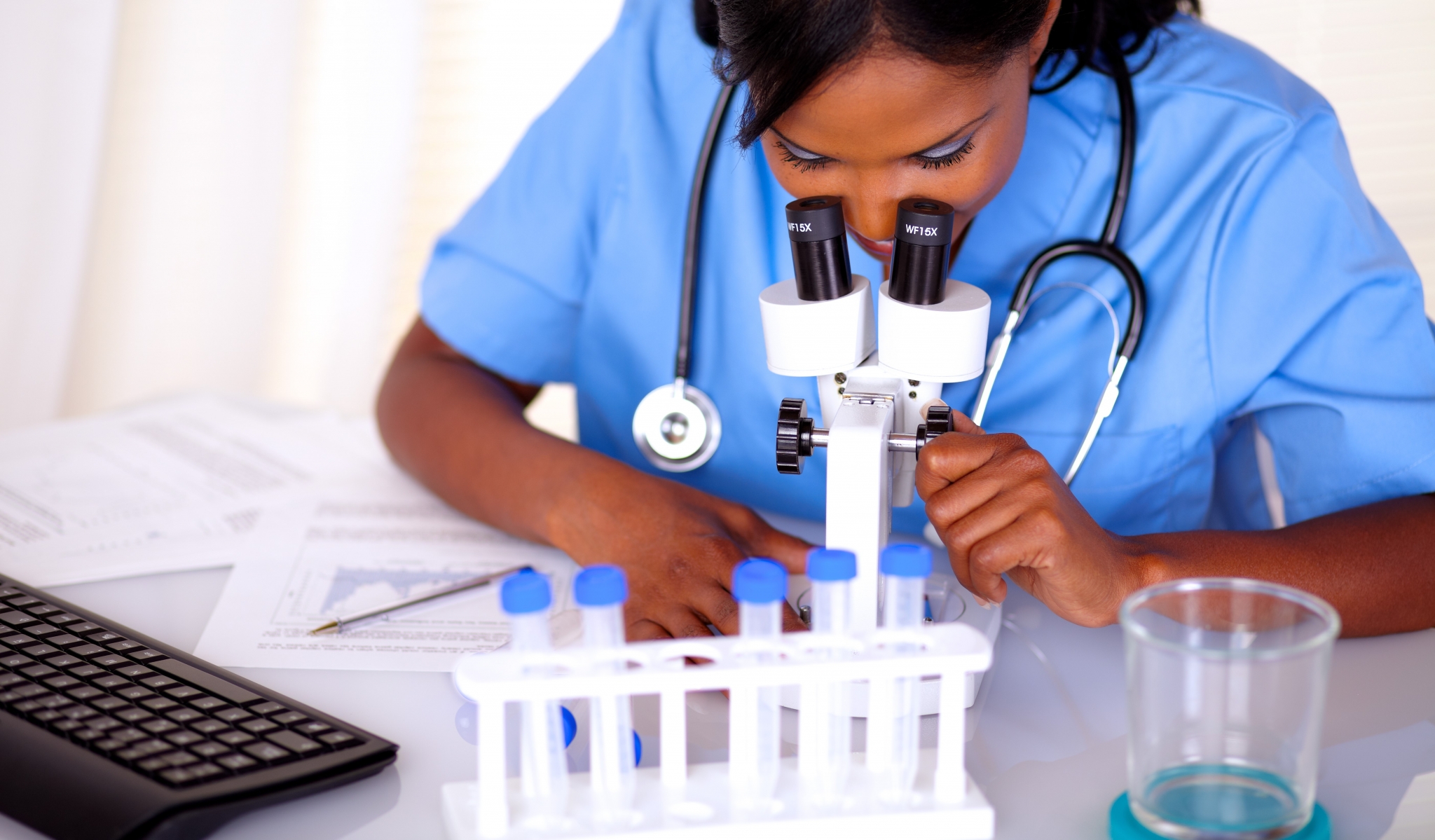 Nurse using lab equipment
