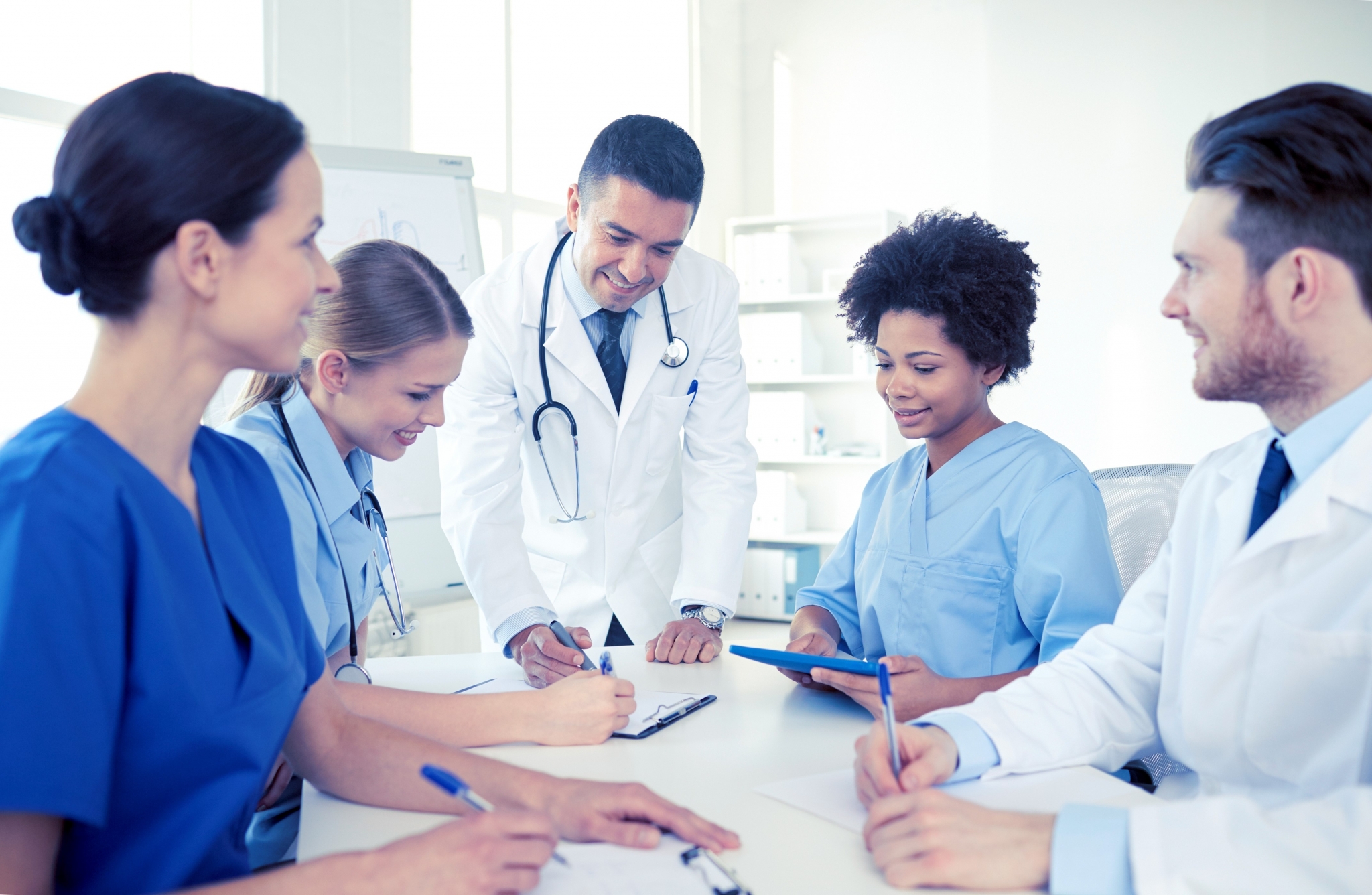 Healthcare team gathered around a table