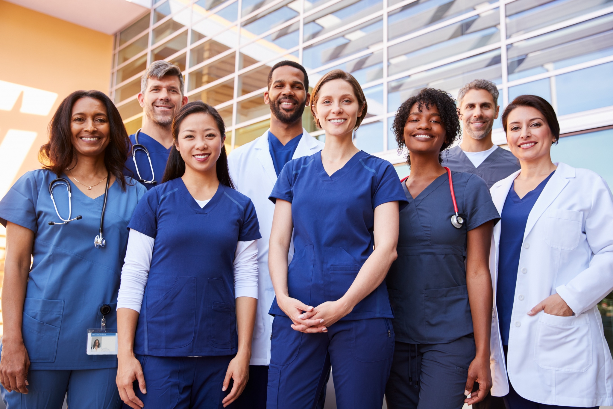 Medical team smiling outside