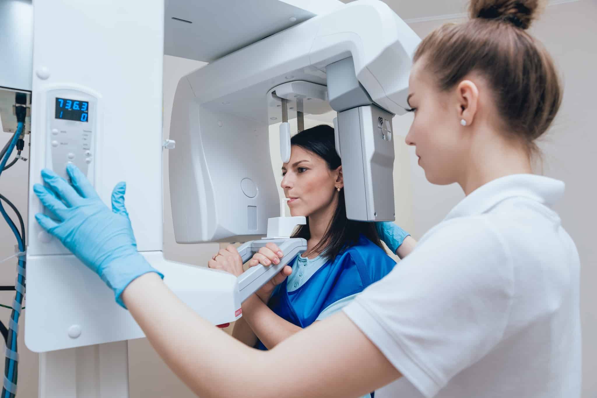 Medical professional taking a dental X-ray