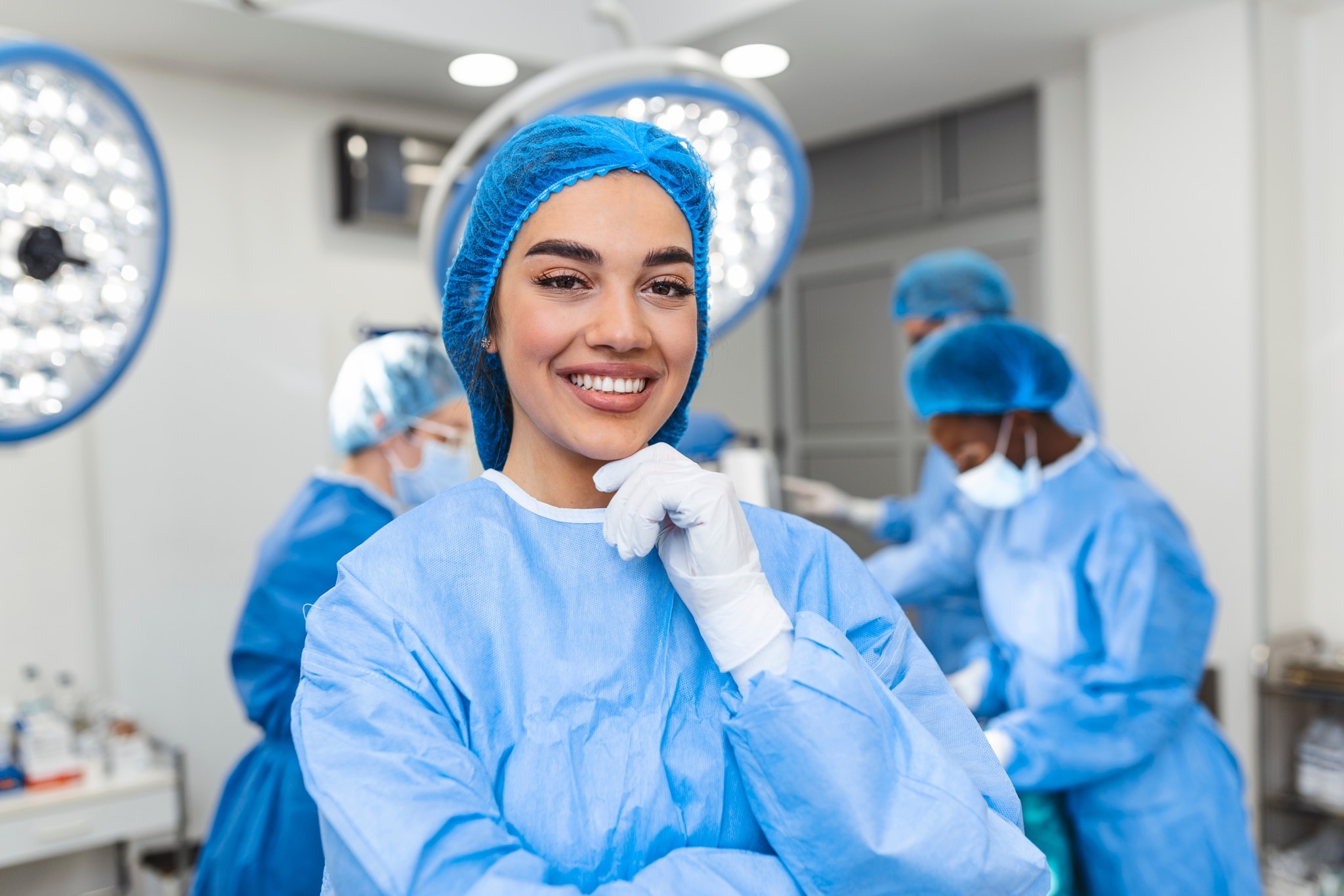 Female surgeon in front of surgical team