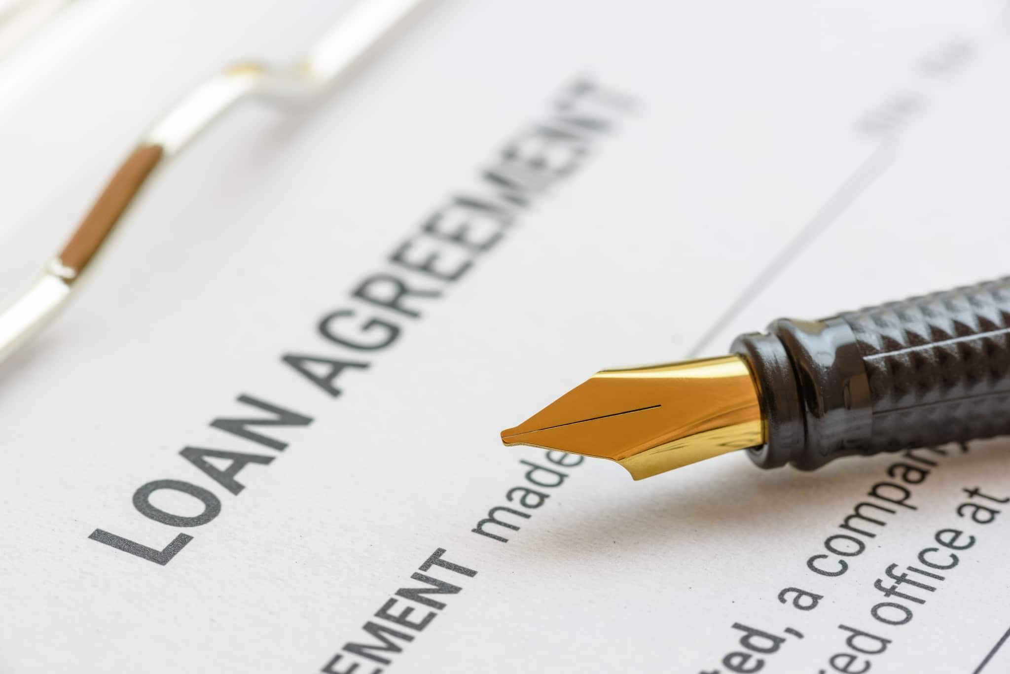 Close up of a loan agreement and fountain pen