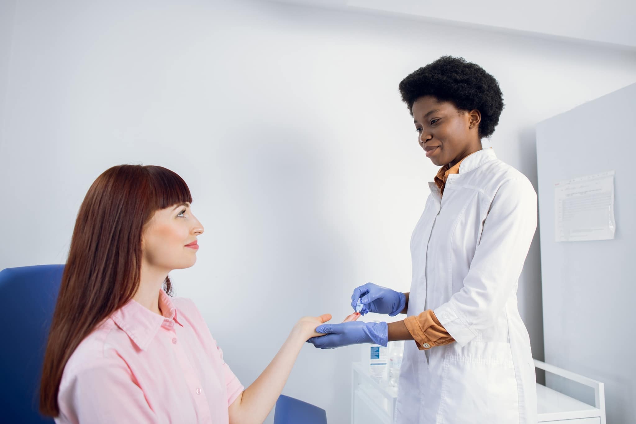 Healthcare worker assisting a female patient