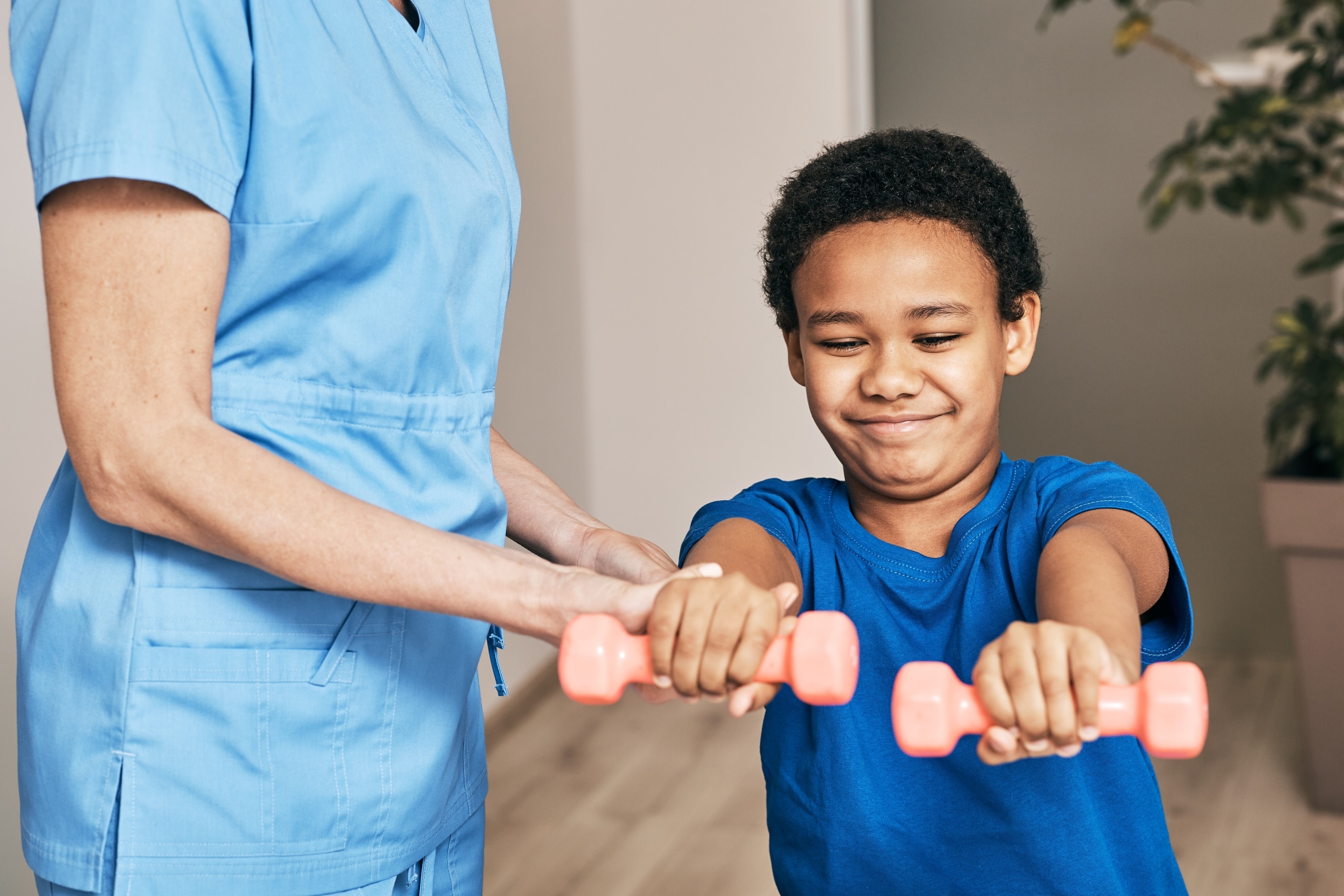 Close up of African-American child performing exercises in physical therapy
