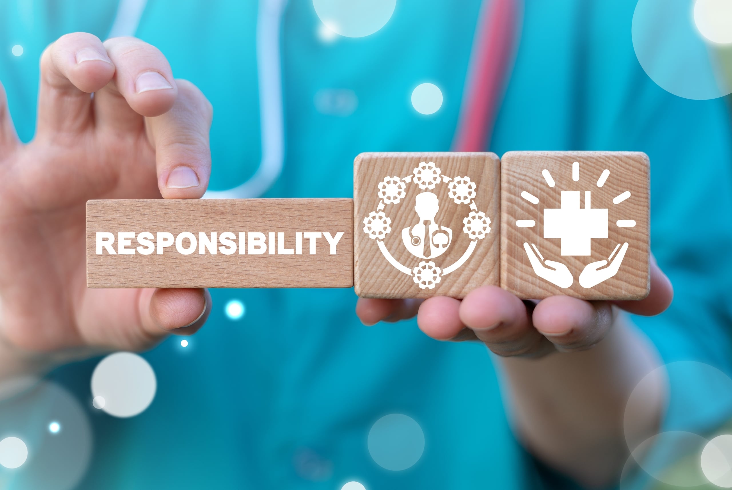Nurse holding blocks with virtual healthcare symbols
