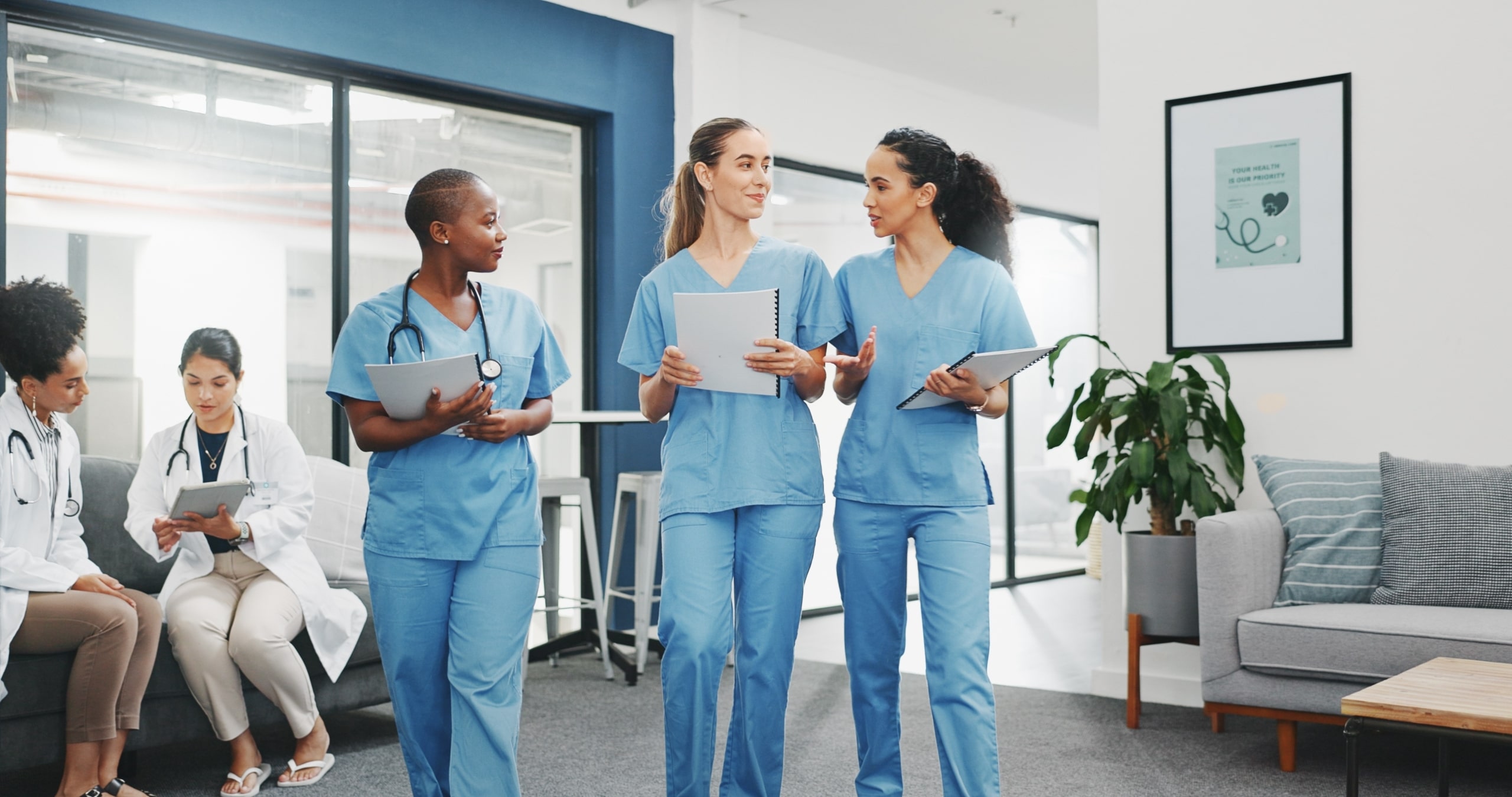 Group of diverse nurses walking in a hallway