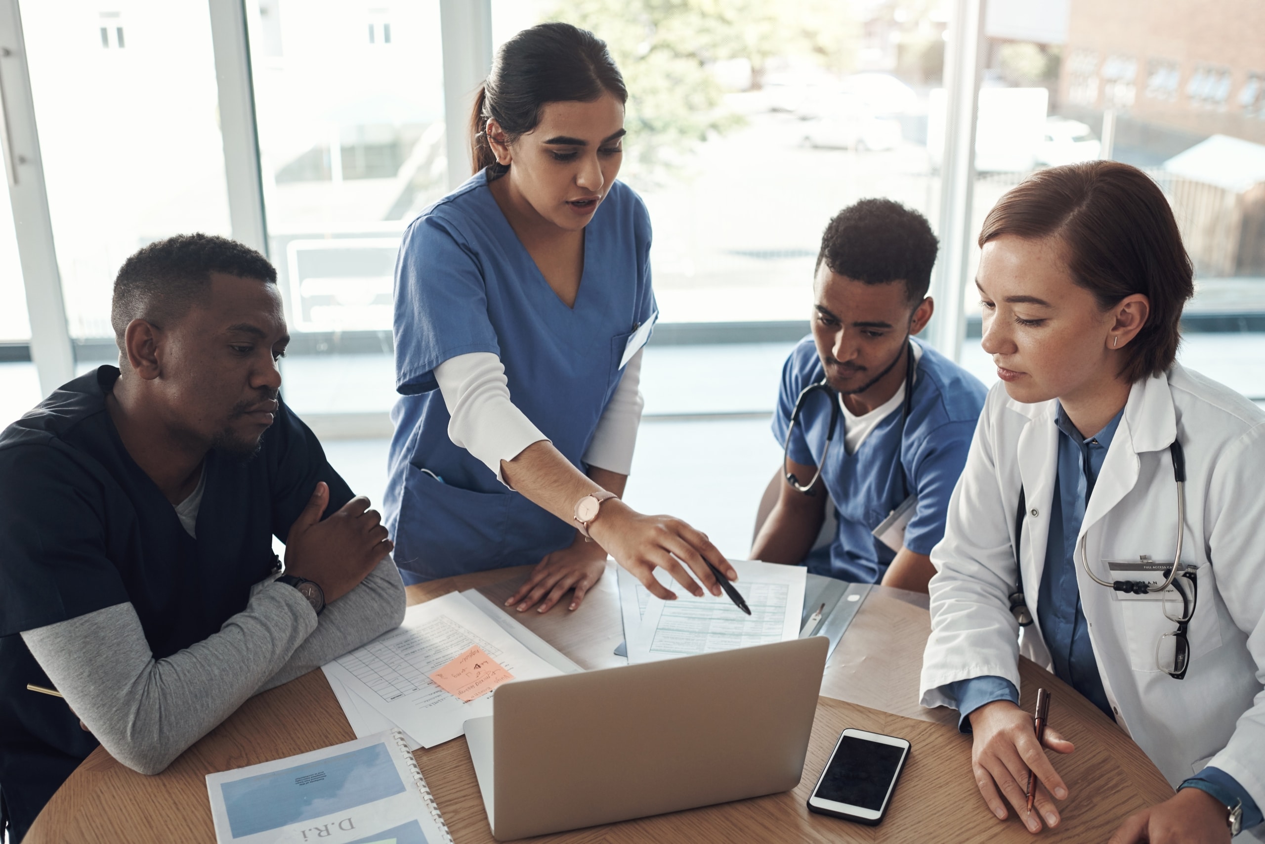 Medical professionals working together at a conference table