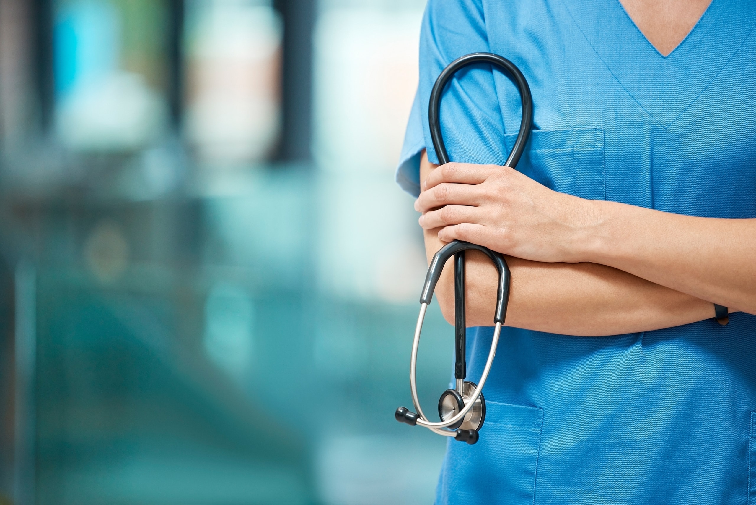Close up of a nurse in scrubs with a stethoscope